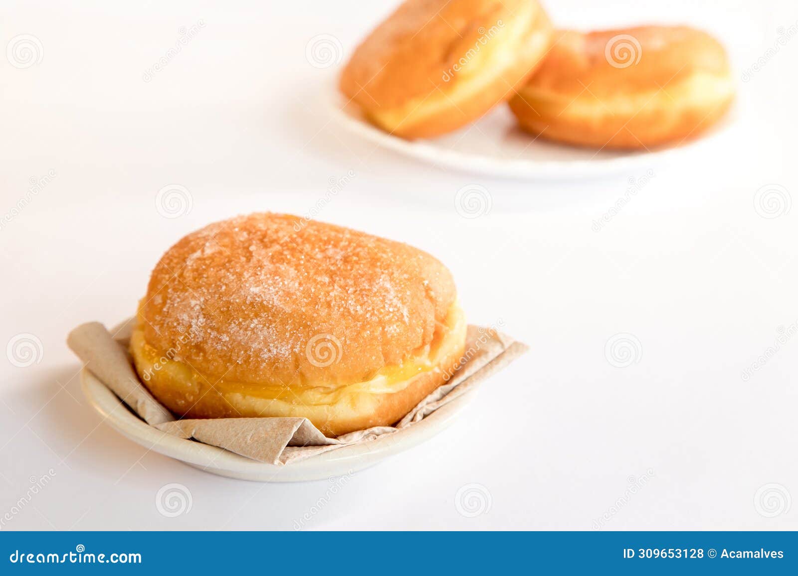 bolas de berlim, berliner or donuts filled with egg jam, a very popular dessert in portuguese pastry shops