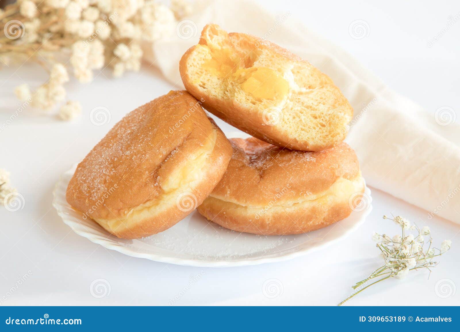 bolas de berlim, berliner or donuts filled with egg jam, a very popular dessert in portuguese pastry shops