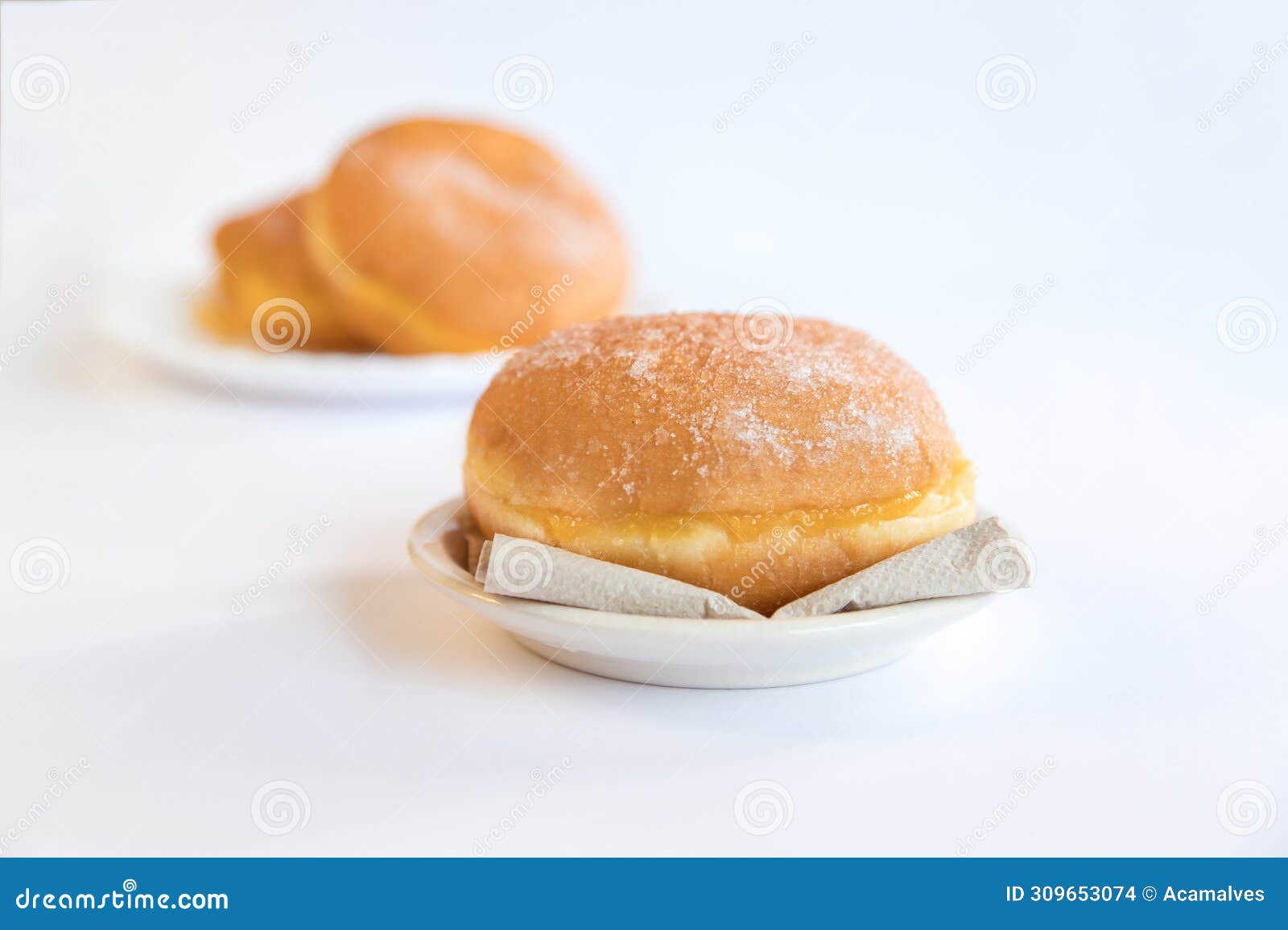 bolas de berlim, berliner or donuts filled with egg jam, a very popular dessert in portuguese pastry shops