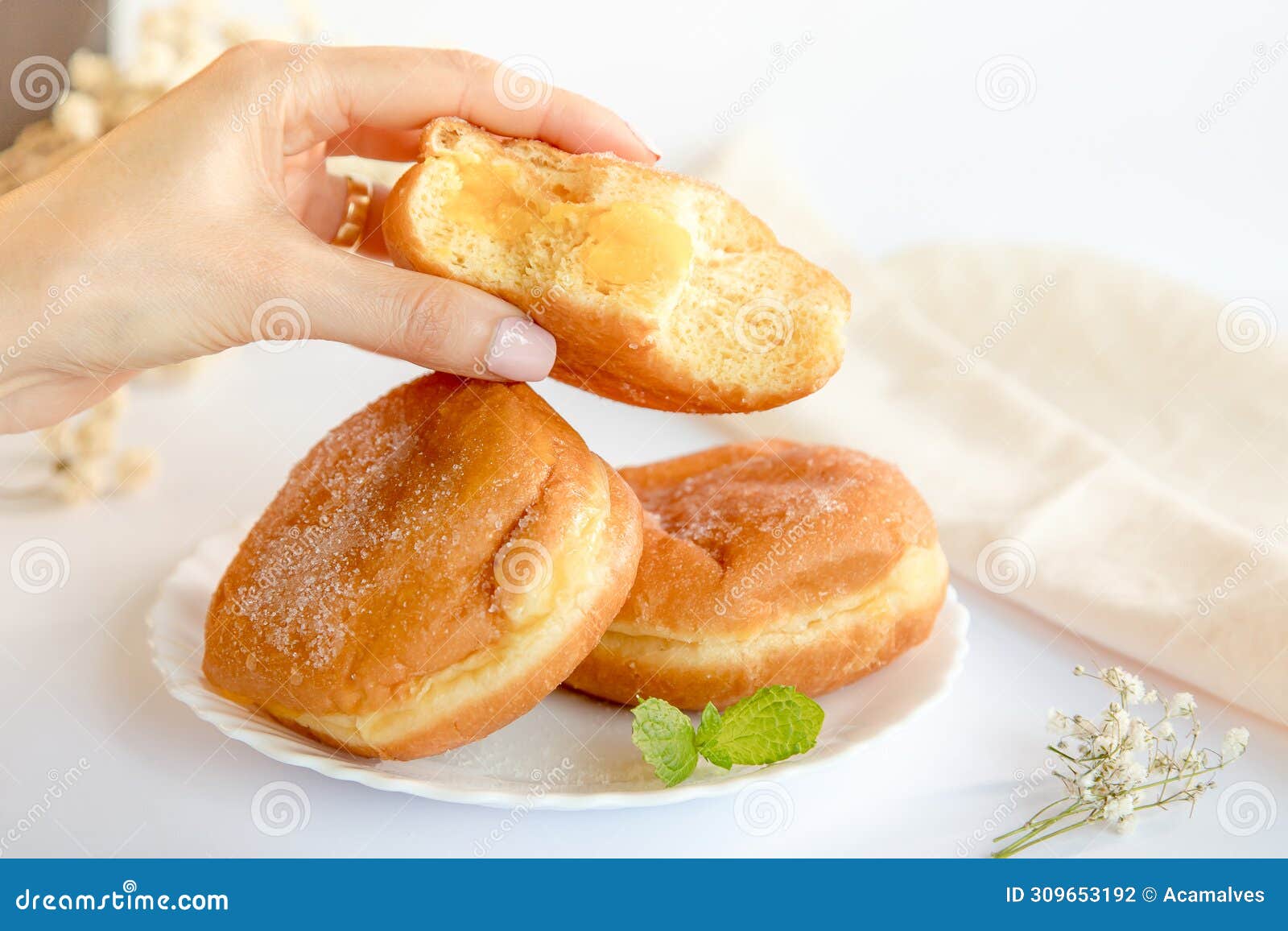 bolas de berlim, berliner or donuts filled with egg jam, a very popular dessert in portuguese pastry shops.