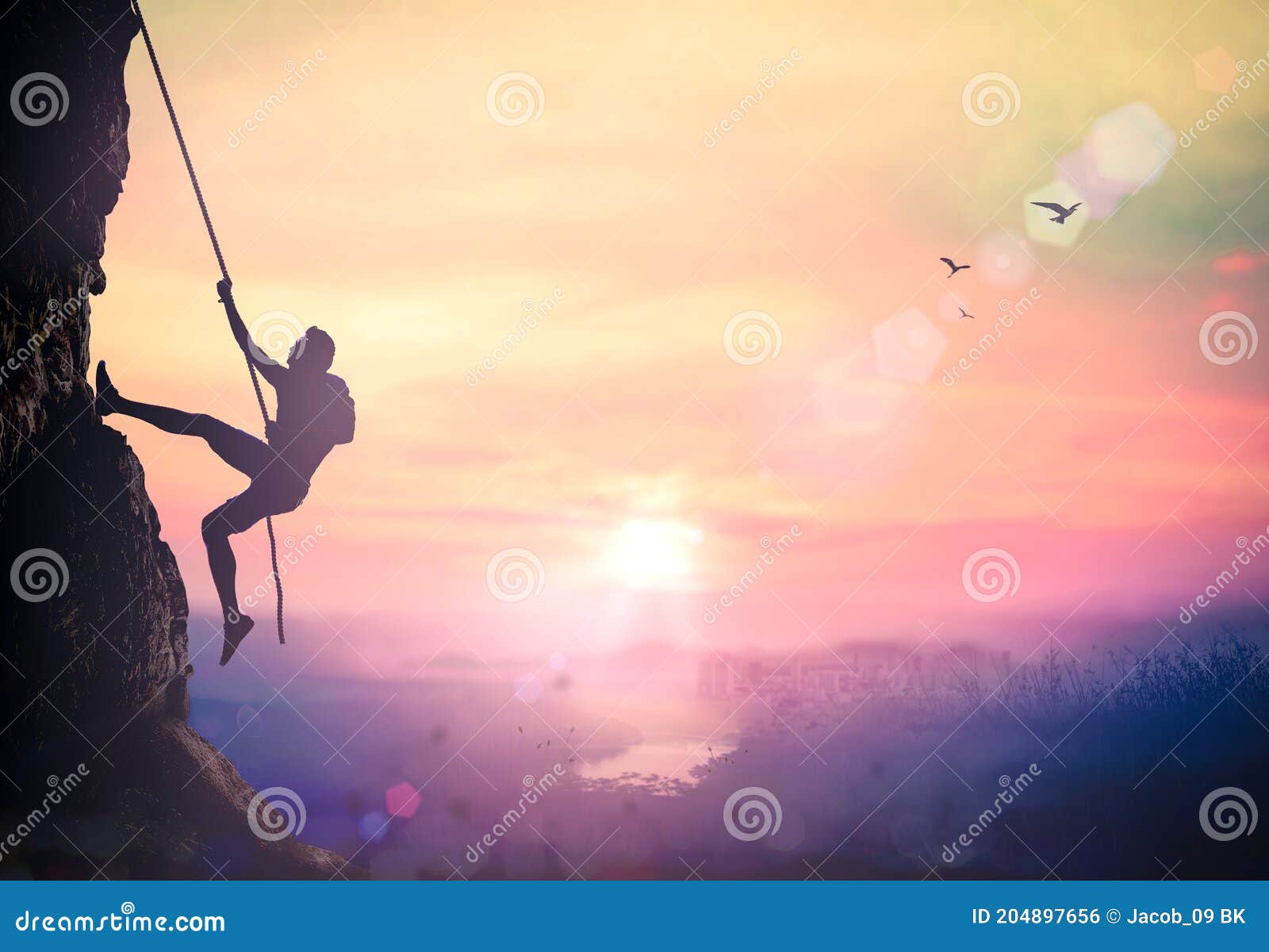 bold heroic man try to climb with rope over natural rocky wall wide valley autumn sunset mountain