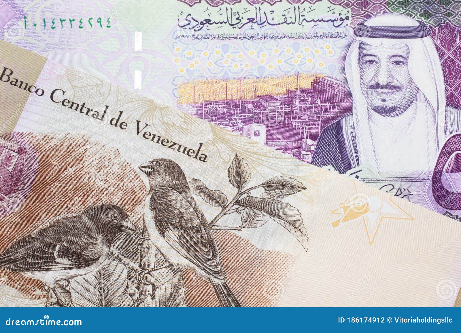 a bolivar note from venezuela with a five riyal note from saudi arabia