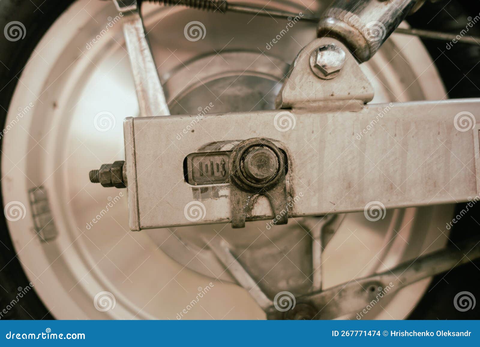 Bolt with Markings for Tightening the Chain on a Motorcycle Stock Photo