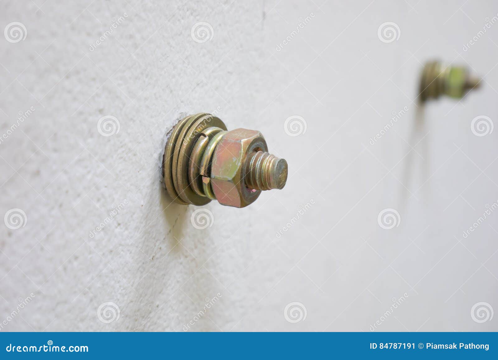 bolt-nut-wall-close-up-84787191.jpg