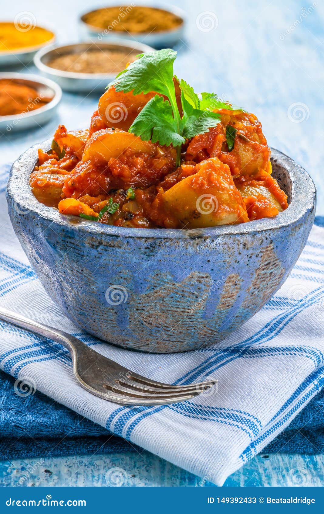 Bombay Aloo - Indian Spiced Potatoes with Tomato Sauce Stock Image ...
