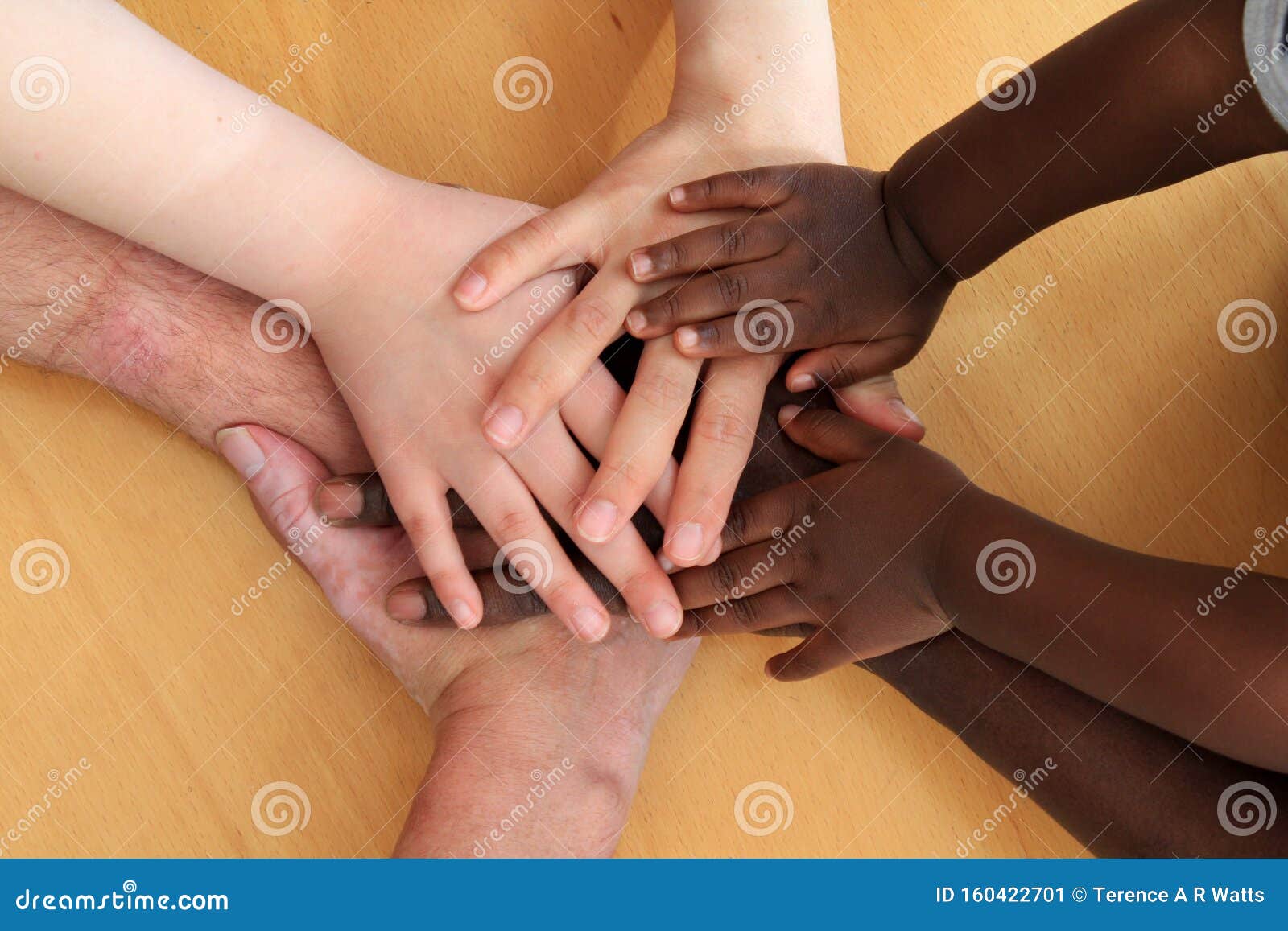 hands layering and depicting racial harmony.