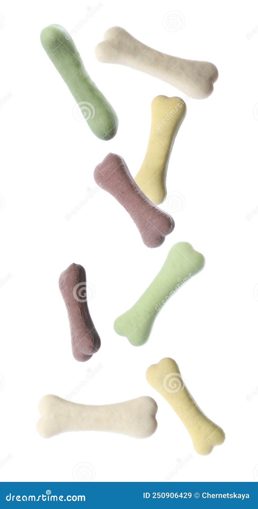 Bone Shaped Cookies for Dogs Falling on White Background Stock Image