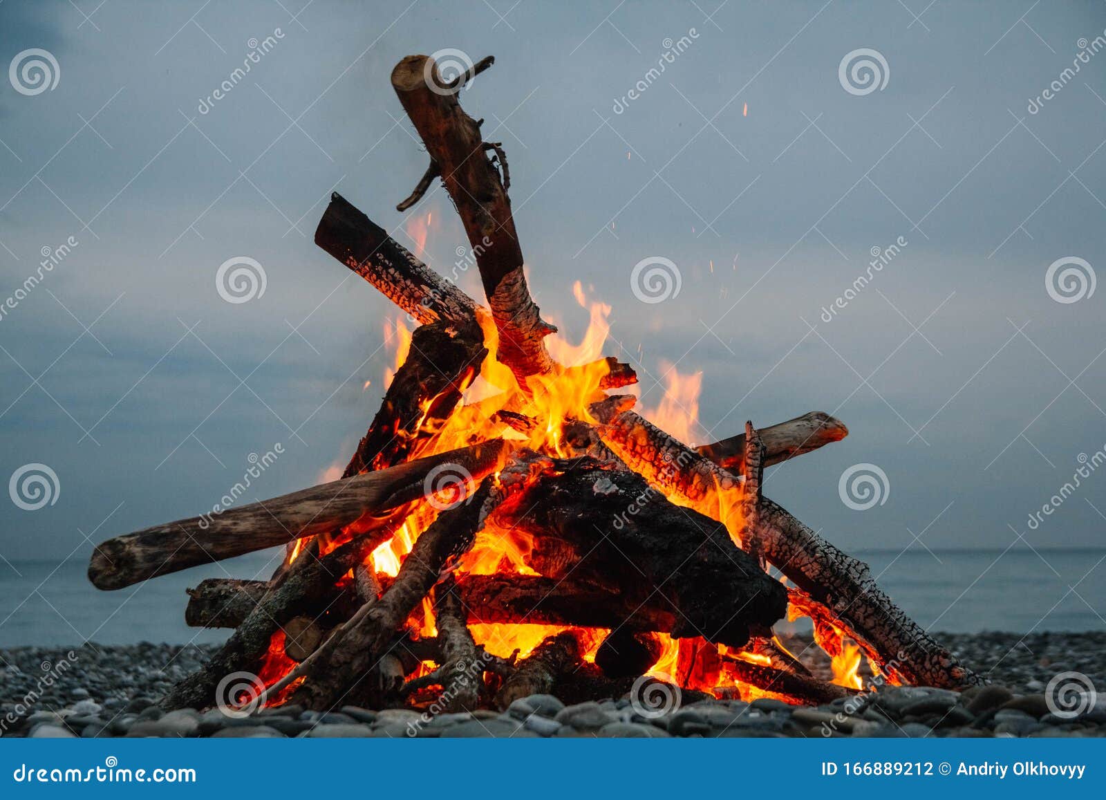 A Bonfire on the Beach. a Bonfire on a Stone Beach. Fire on the Beach