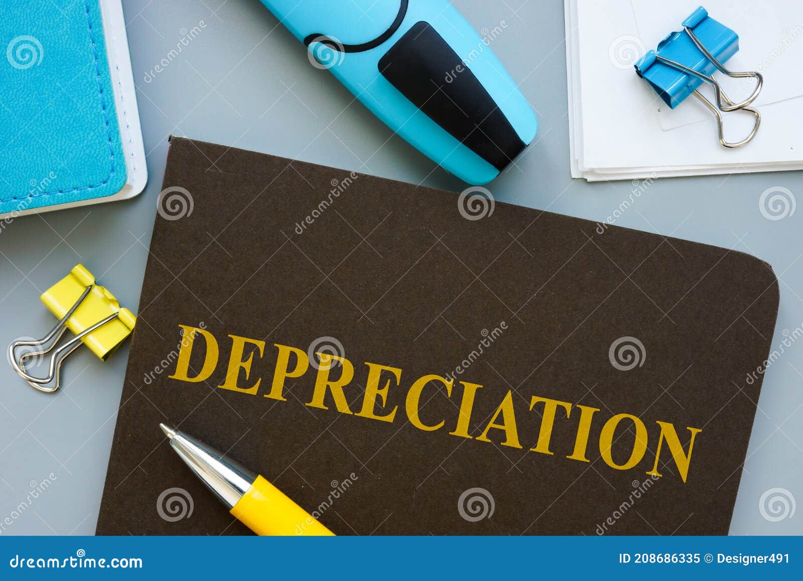 book about depreciation and pen on the table.