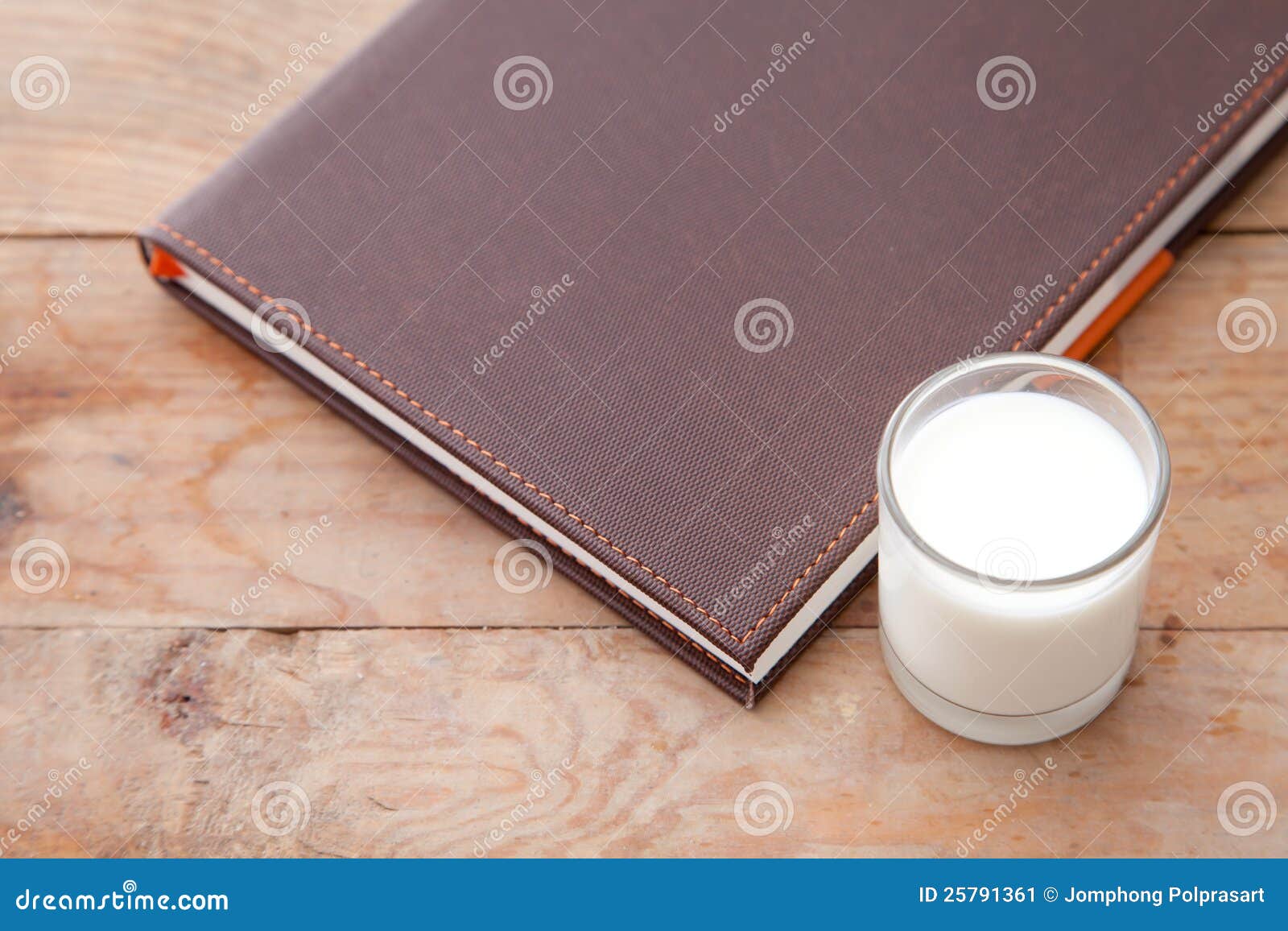 Book and milk on the table