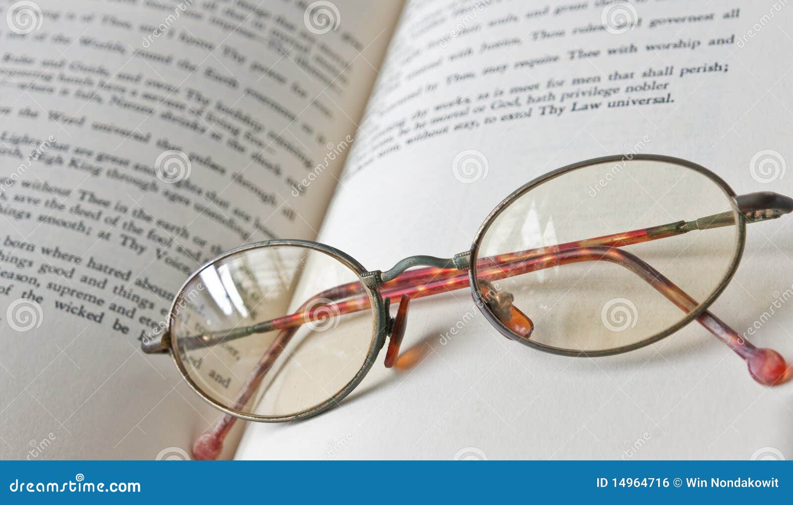 book & old eyeglass