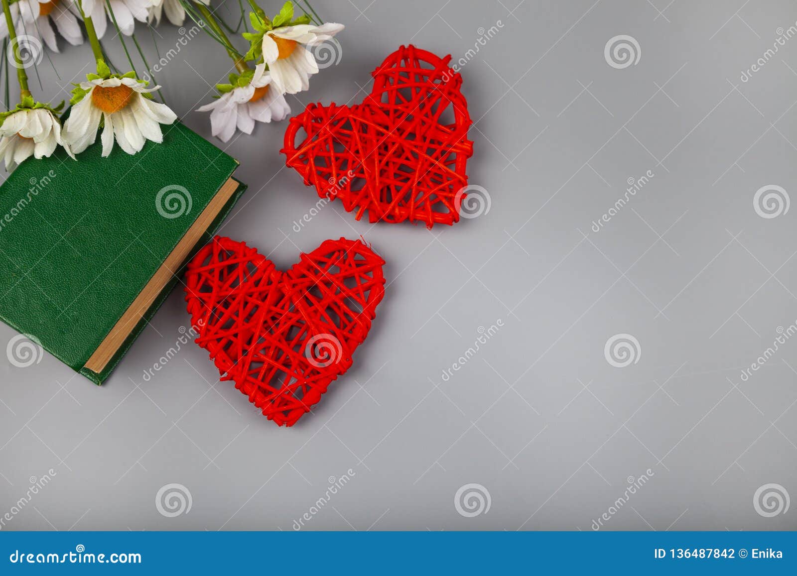 book with romantic poems, flowers and two hearts