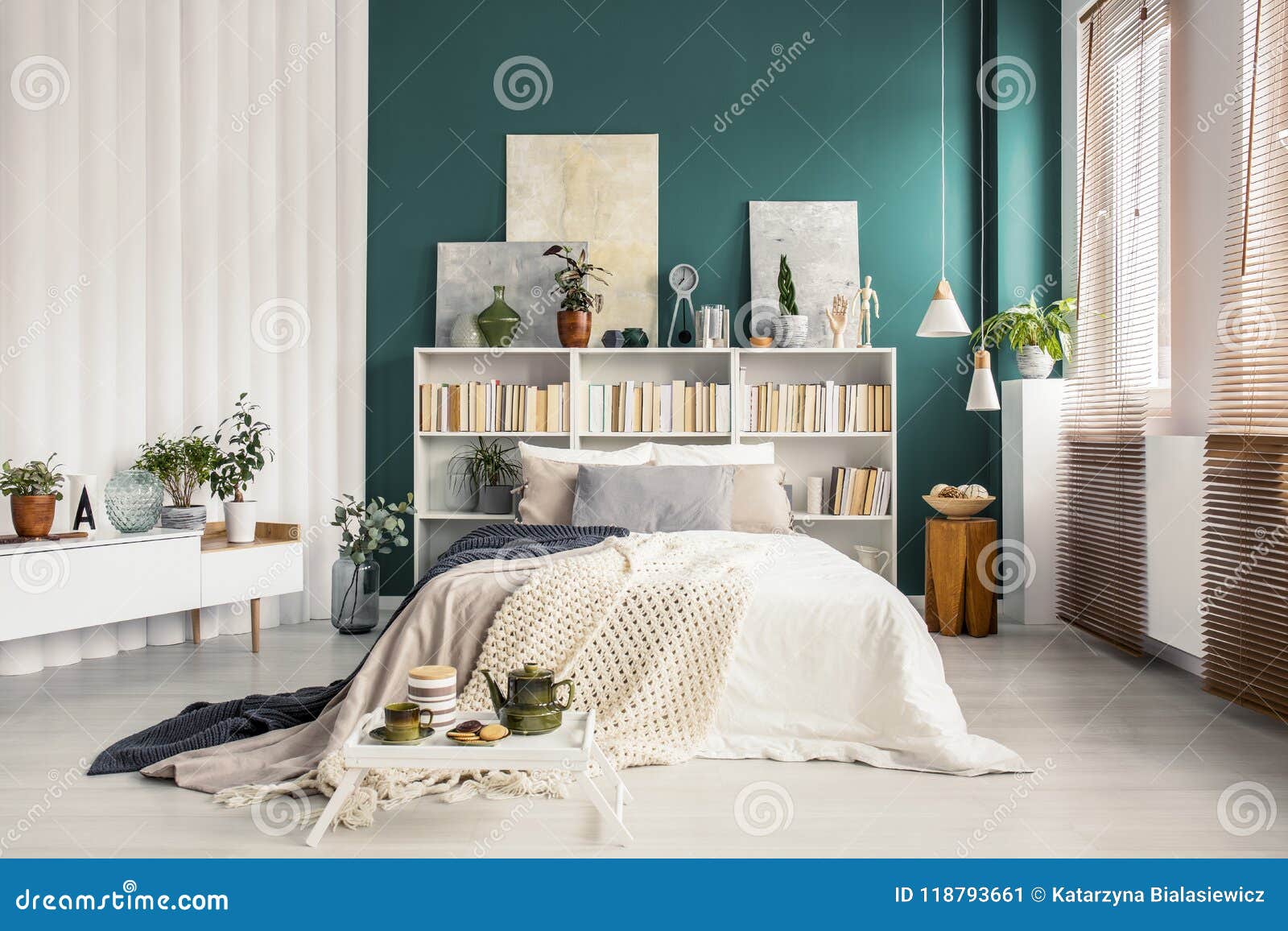 bookcase headboard in green bedroom