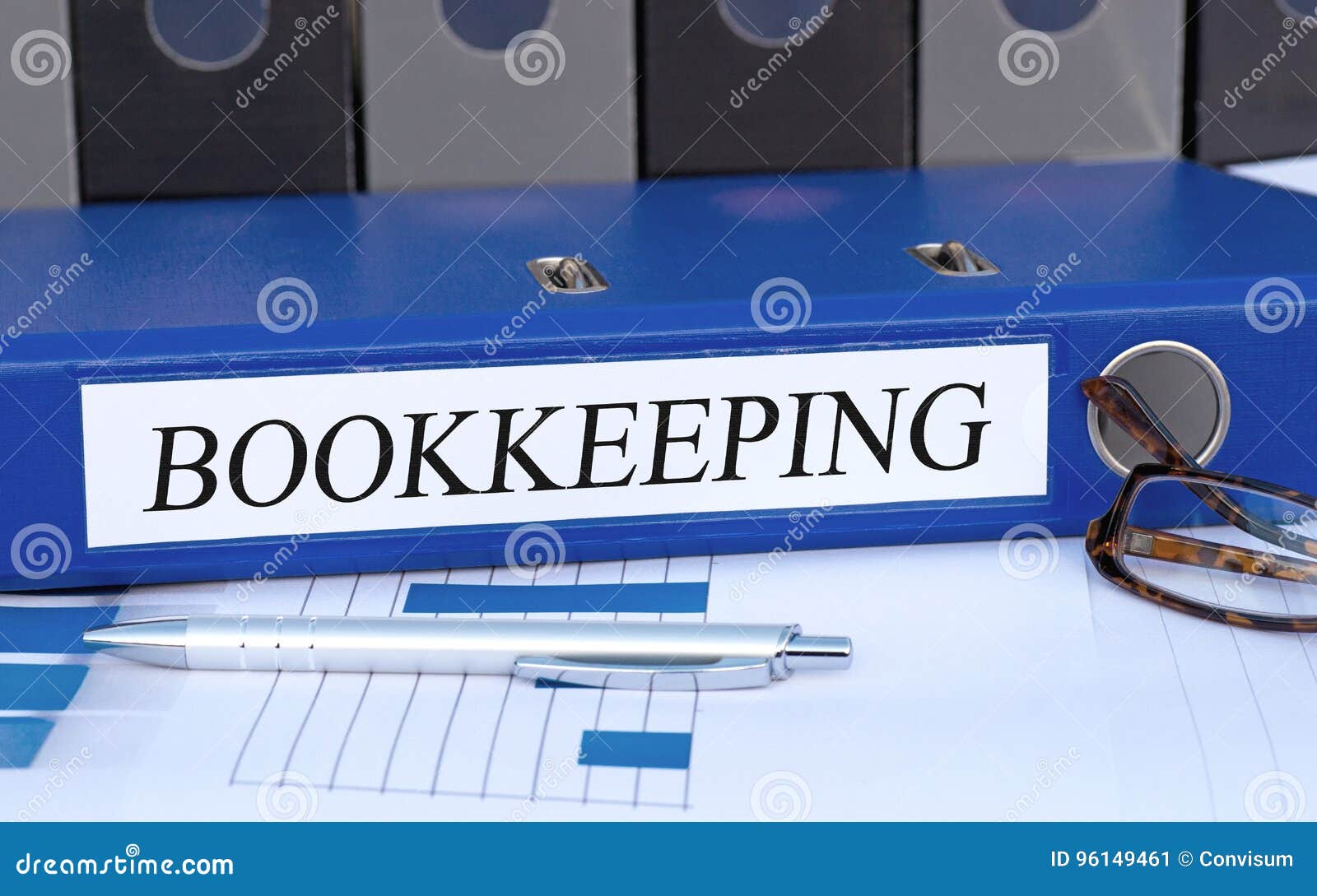 bookkeeping - blue binder with text in the office