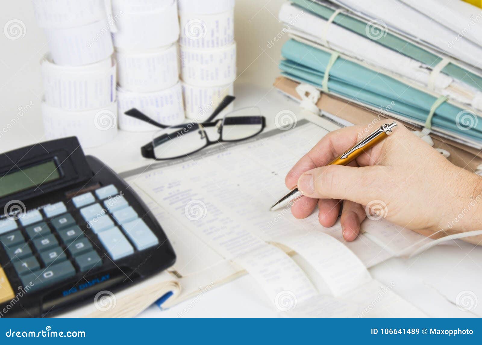 bookkeeping files and tools with eyeglasses. audit concept