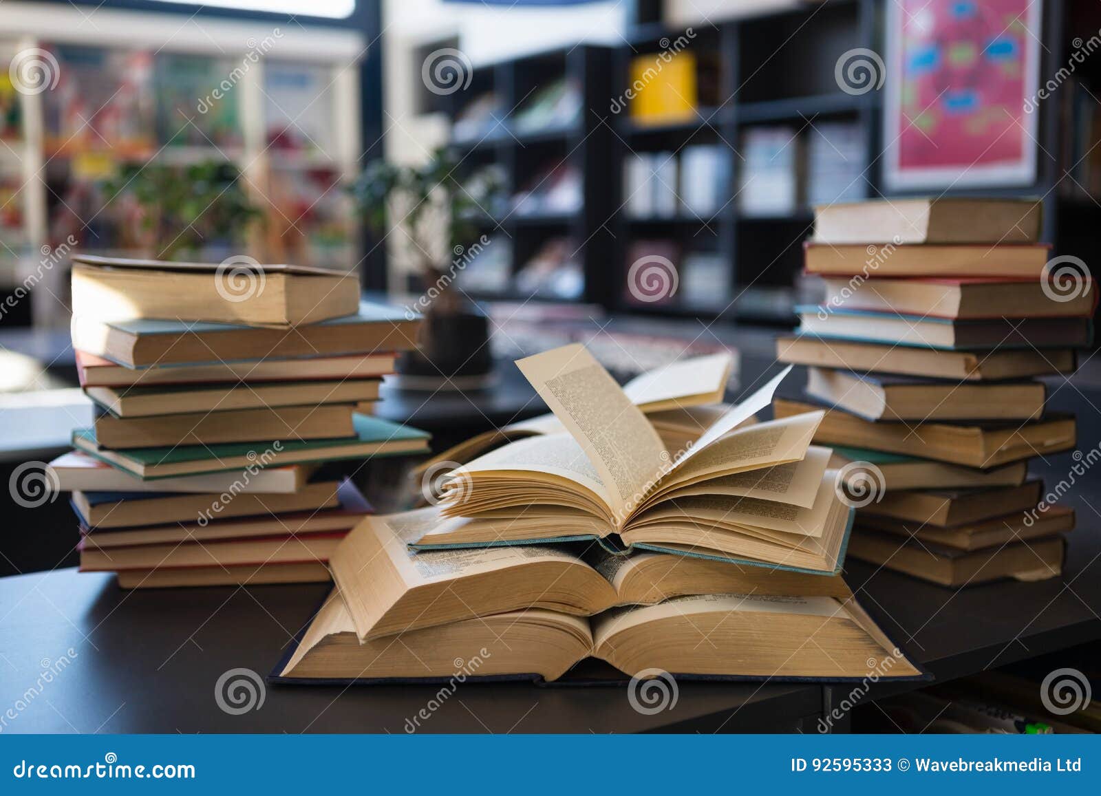 Books on Table Against Shelf in Library at School Stock Image Image