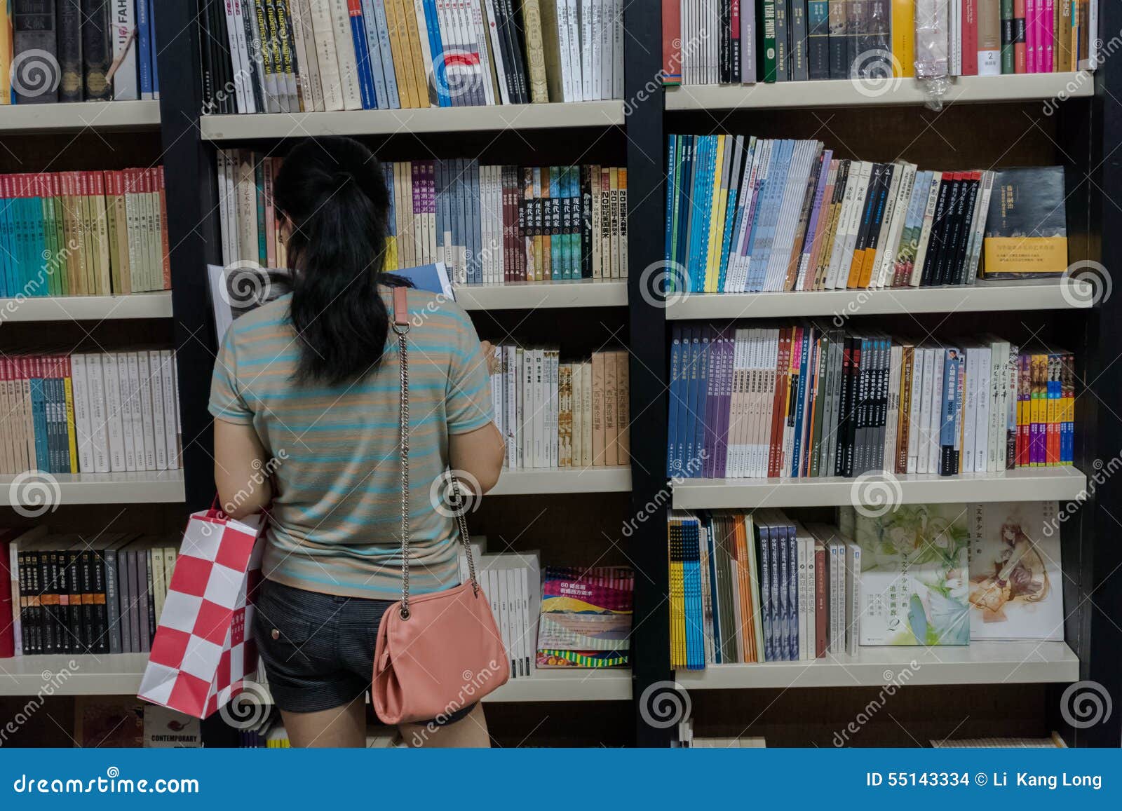 Bookstore readers editorial stock image. Image of bookshelf 55143334