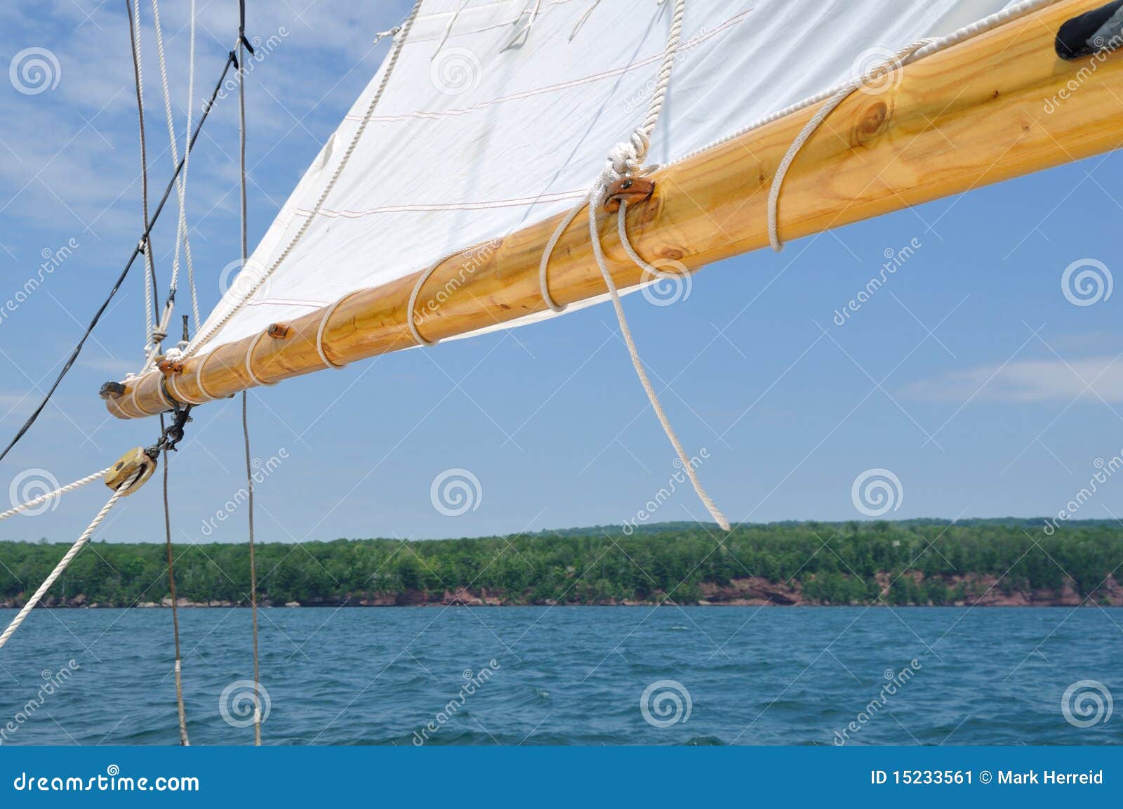 what does the boom do on a sailboat