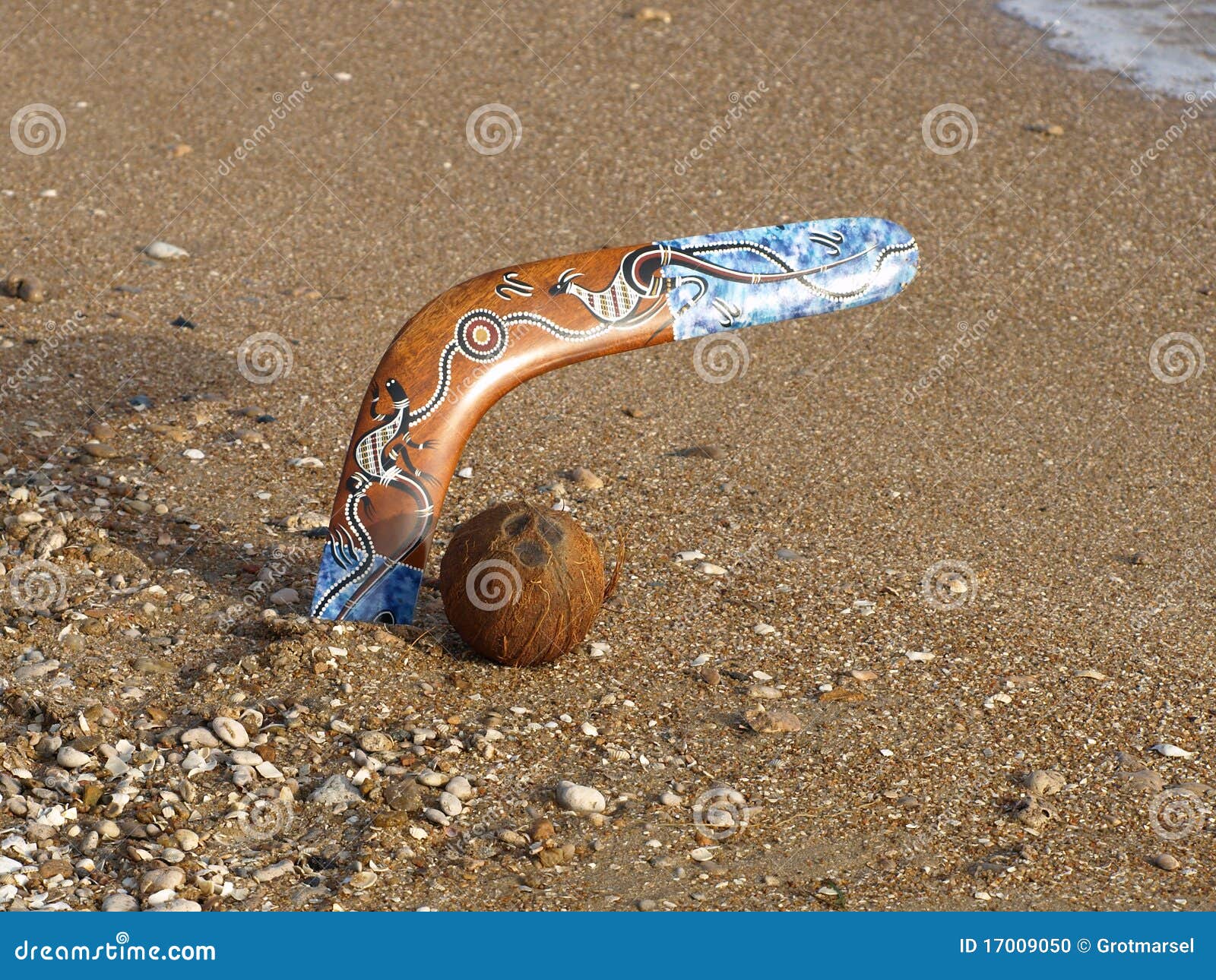 Boomerang and Coconut on a Beach. Stock Photo Image of outback