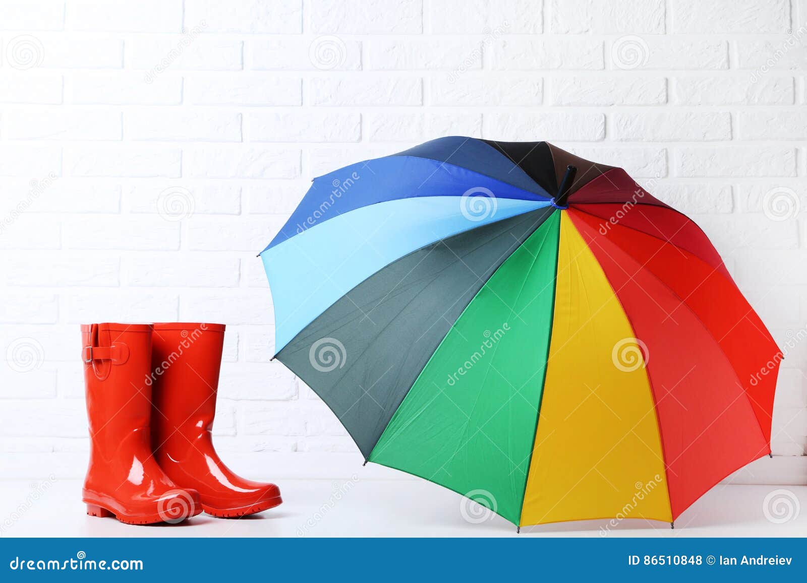 Boots with umbrella stock photo. Image of clothing, gumboots 86510848