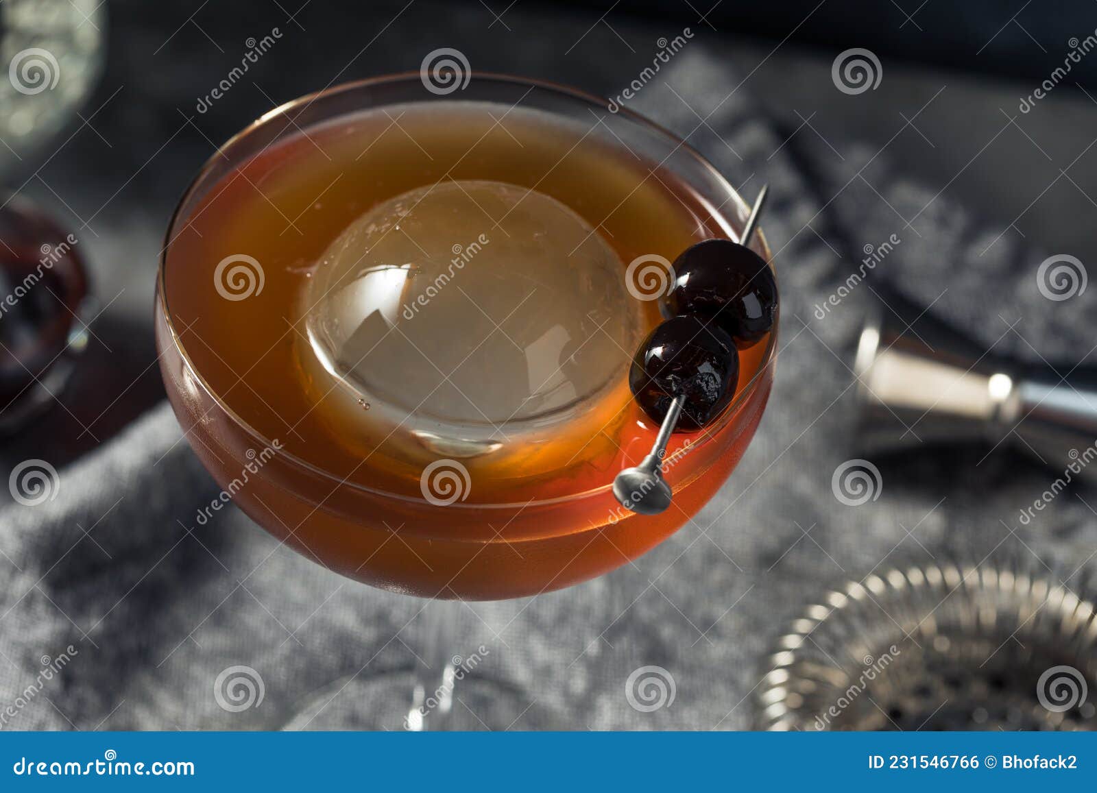 Boozy Cold Manhattan Cocktail with a Big Ice Cube Stock Photo Image