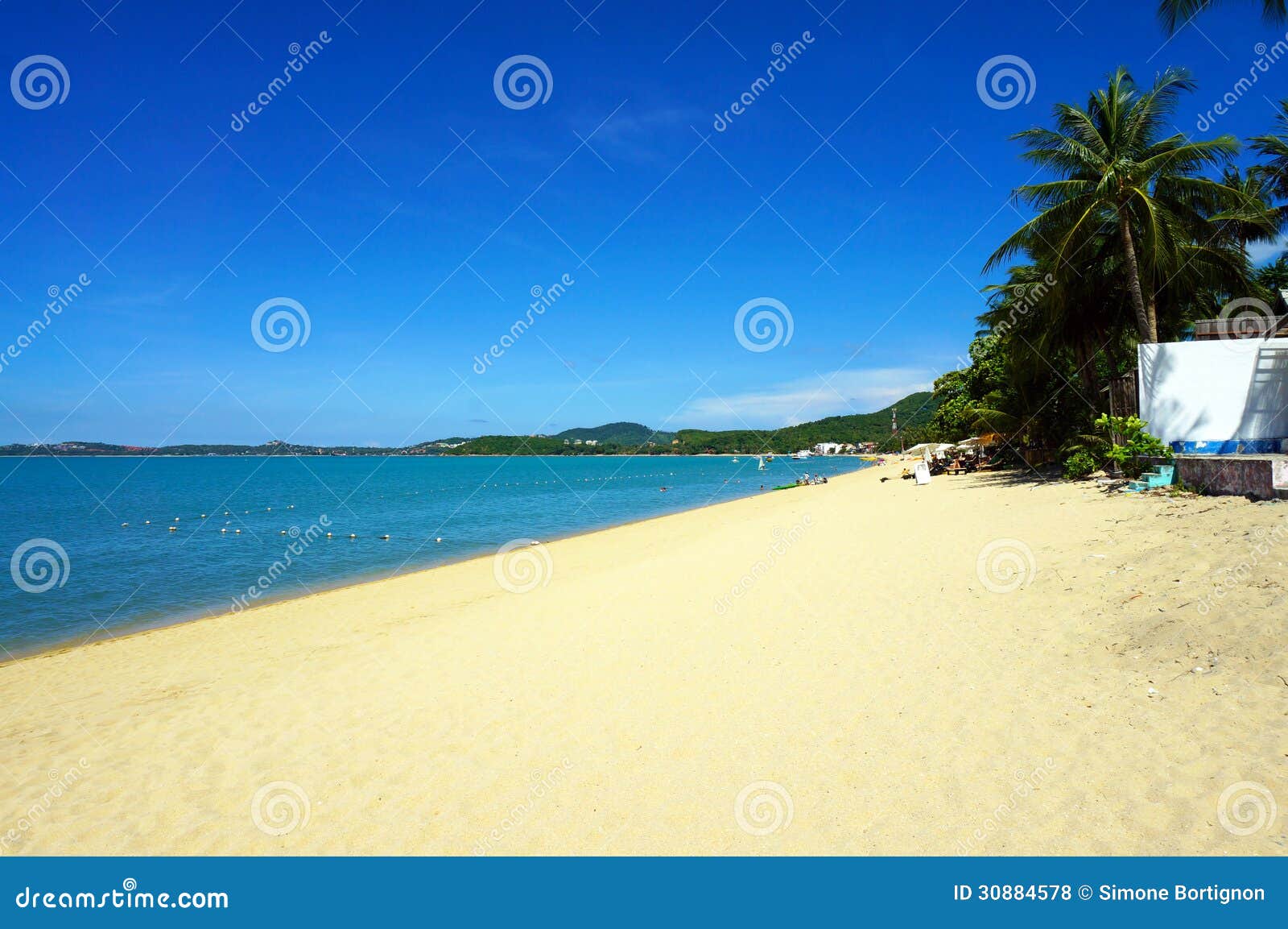 the bophut beach with white sand and blue sky