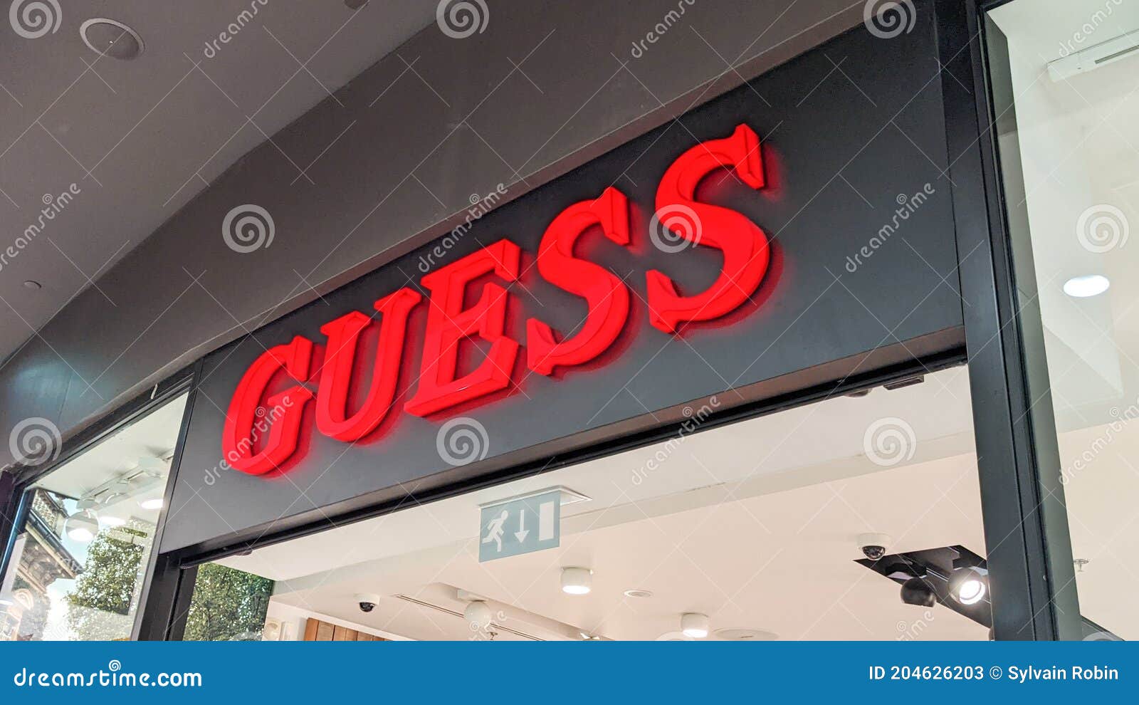 Guess Storefront Text and Logo Shop Sign of Store Luxury Clothing ...