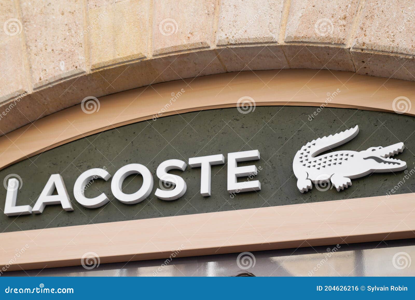Lacoste Logo Crocodile Sign and Text Front of Store Famous French