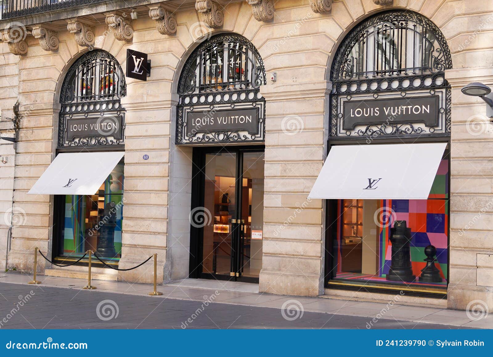 louis vuitton logo and sign text facade entrance store fashion brand  clothes shop in street view Stock Photo