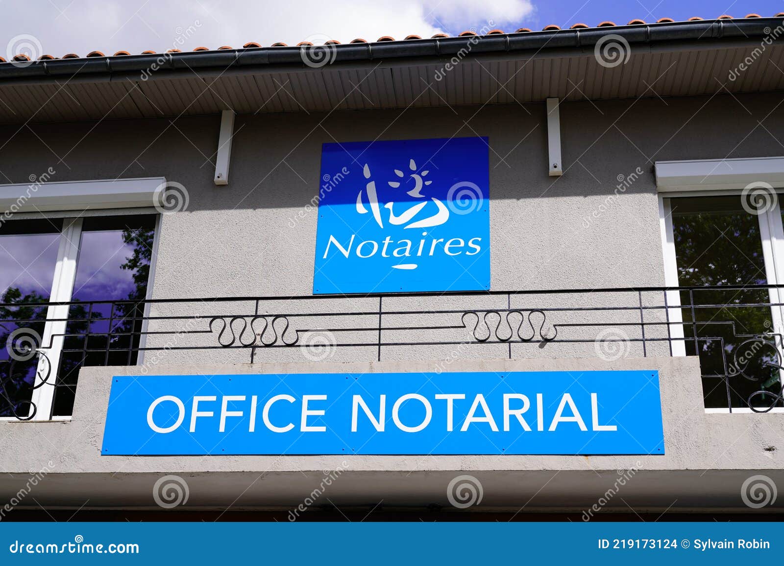 notaire office notarial label french text sign and brand logo front of wall notary