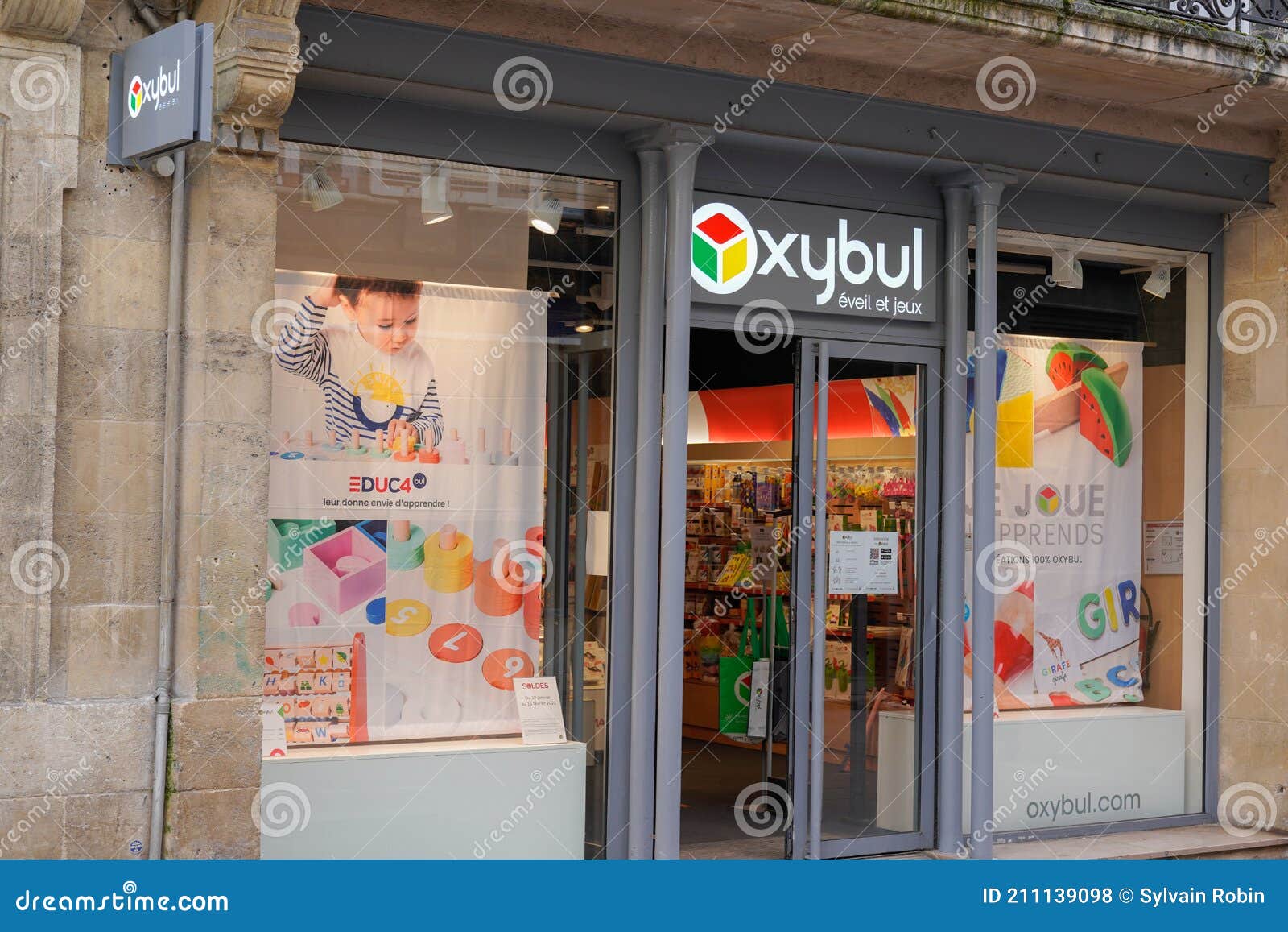Oxybul Eveil Et Jeux Logo Brand and Text Sign Front of Child Toys