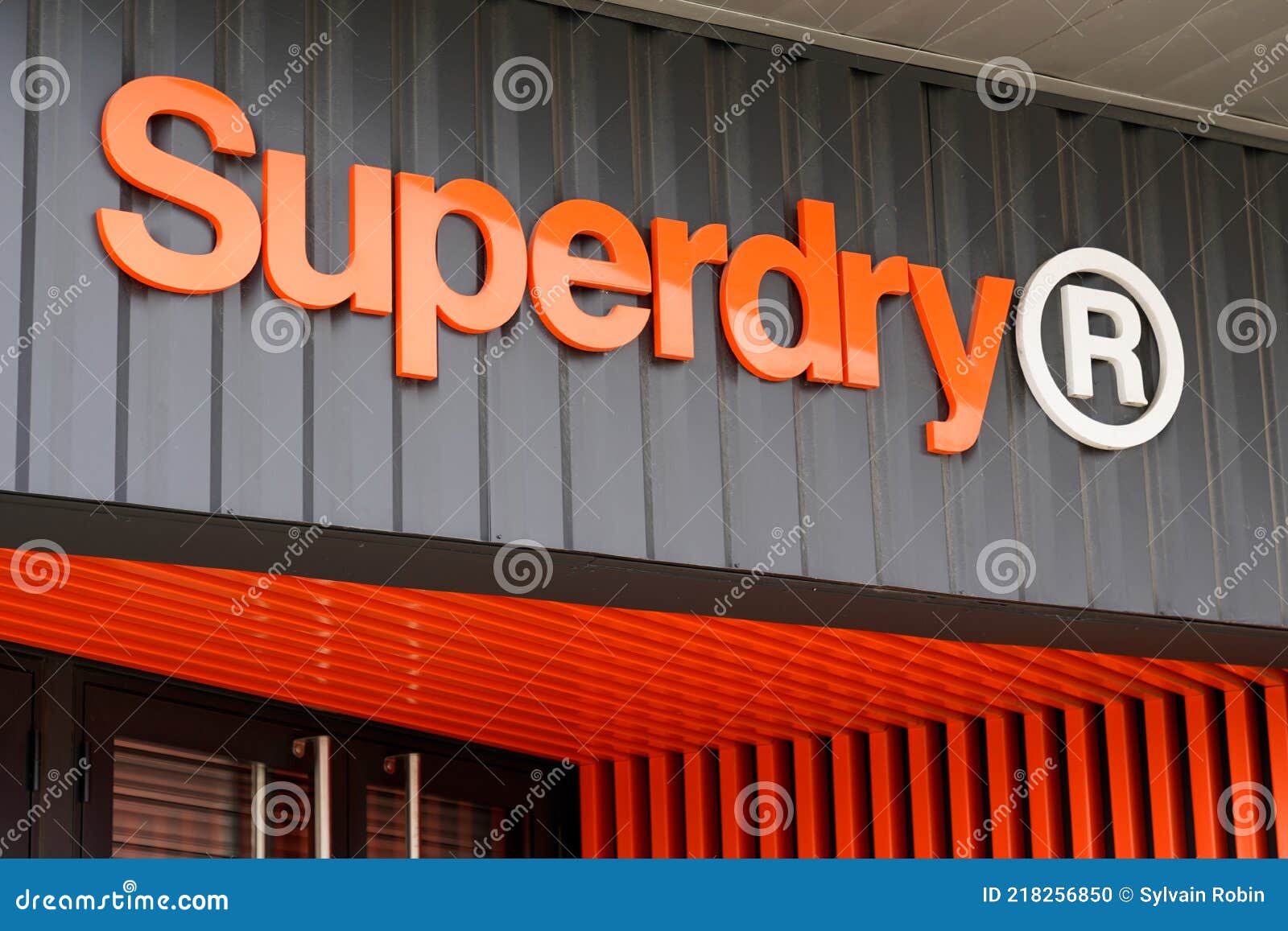 Superdry Logo Brand and Orange Sign Text for Store of British