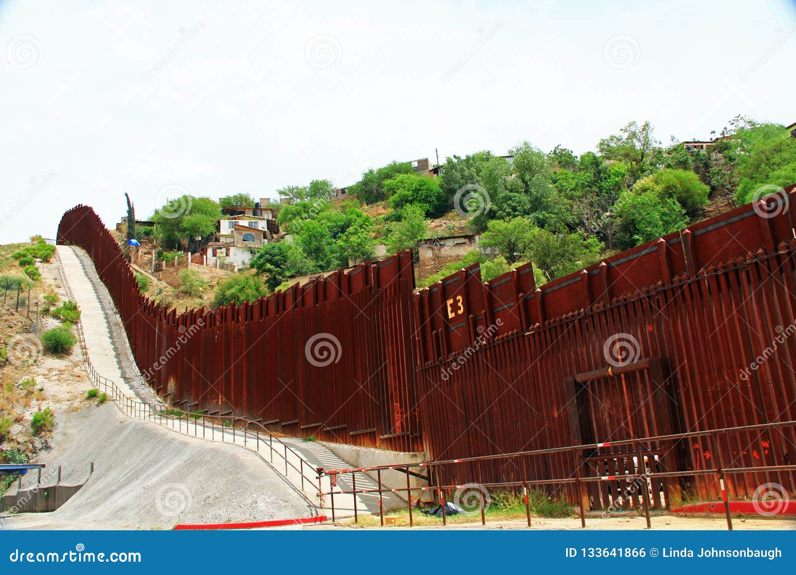 border fence separating the us from mexico in nogales, arizona