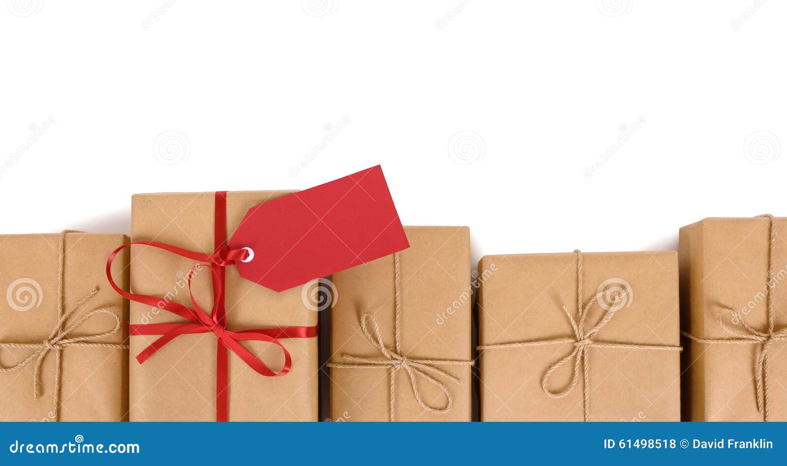 border row of brown paper parcels, one unique with red ribbon bow and gift tag