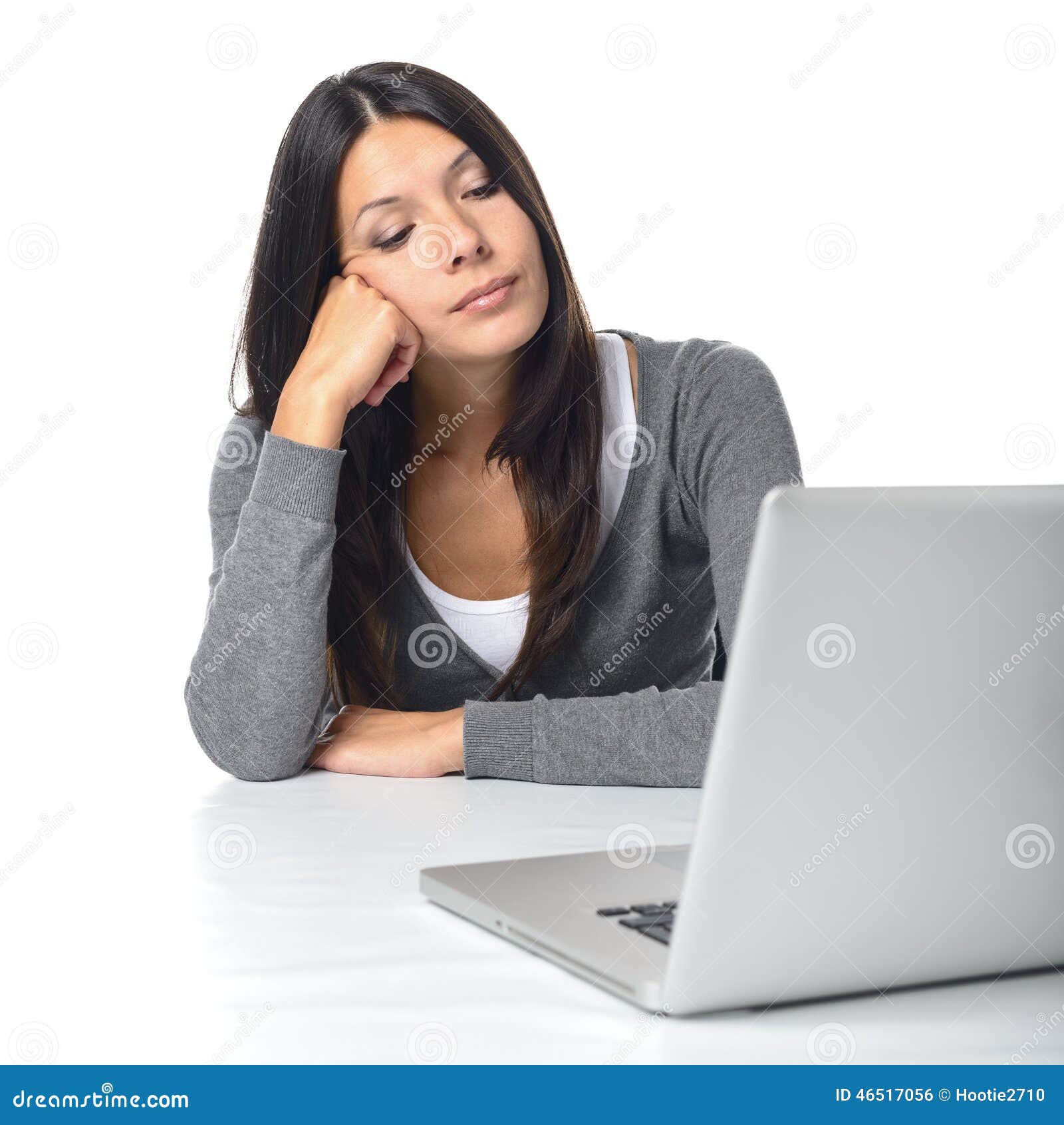 bored businesswoman staring at her laptop computer stock photo