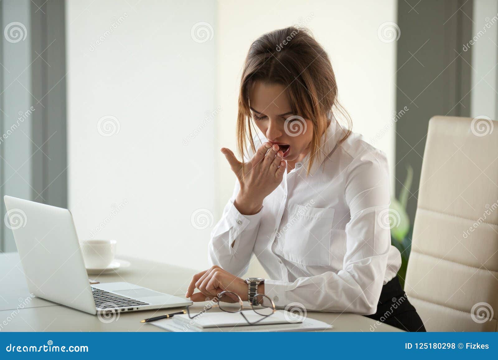 bored impatient businesswoman yawning checking time tired of ove