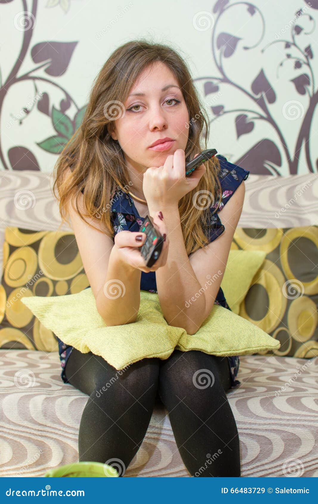 Bored Girl Holding The TV Remote Control S