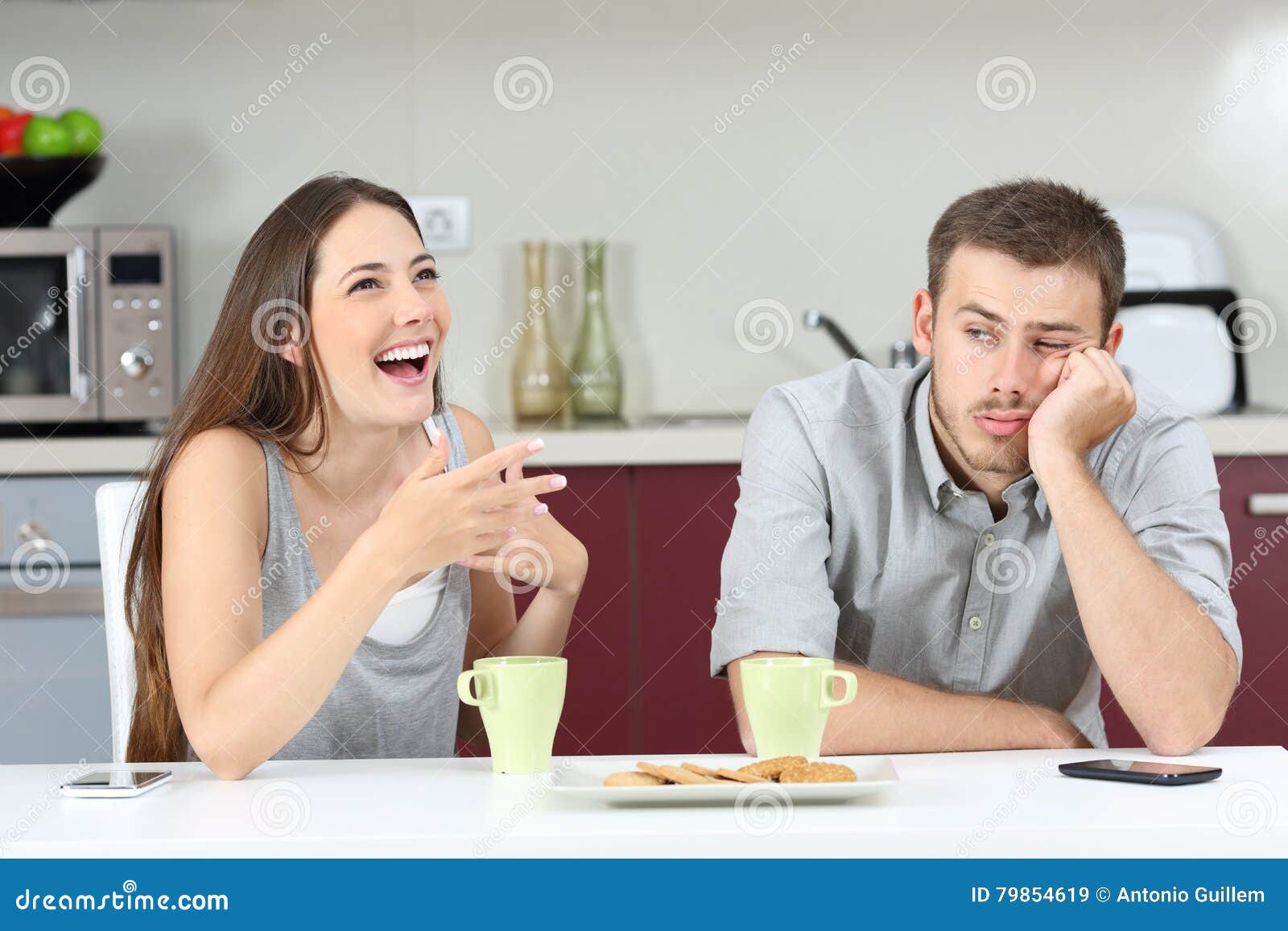 bored husband hearing his wife talking