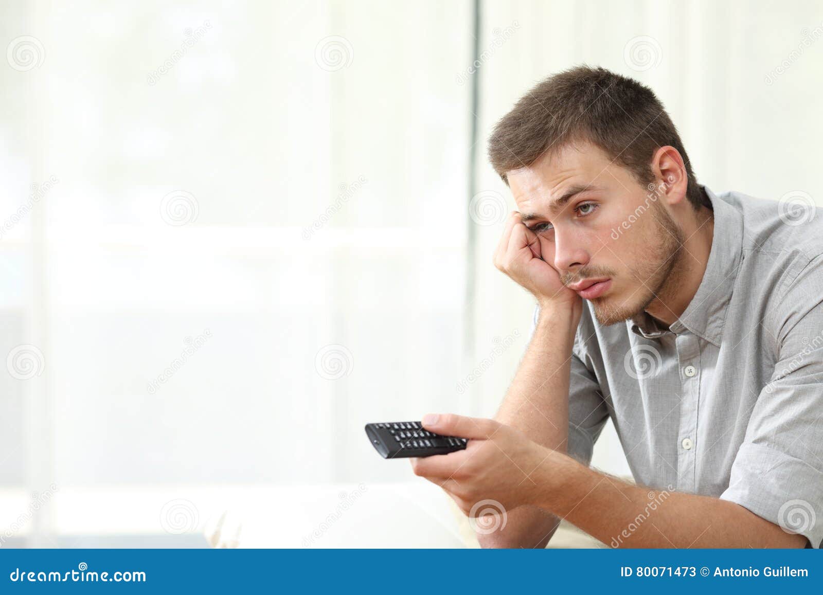 Bored Man Watching Tv and Zapping Stock Image Image of dull
