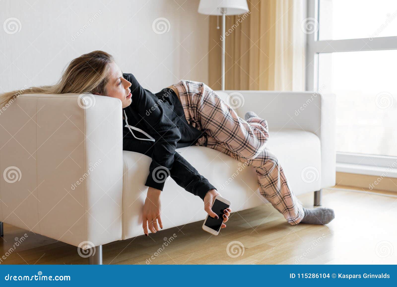 bored woman lying in sofa