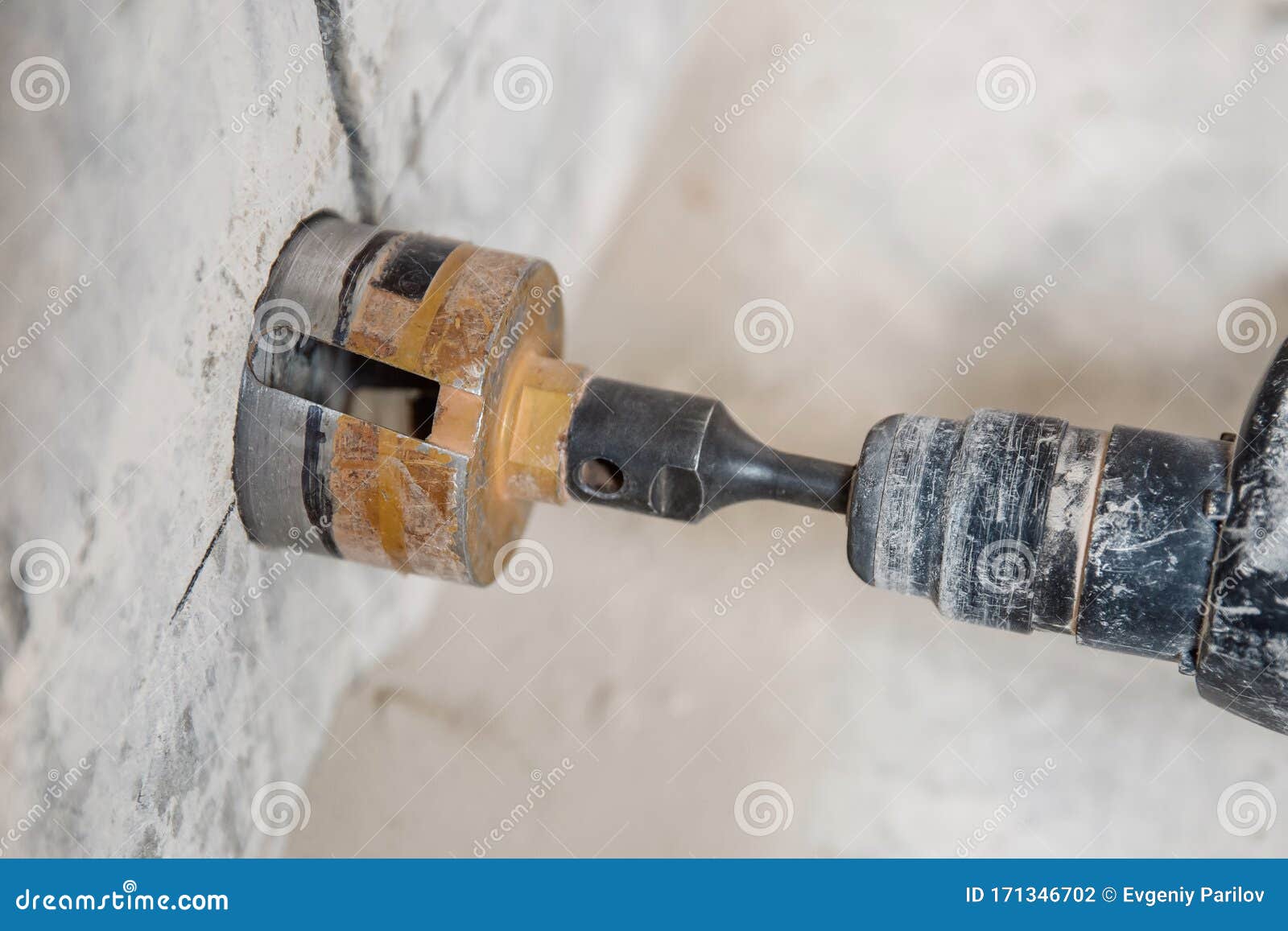 Boring Hole in Wall for Electric Outlet by Power Hammer Drills Tool