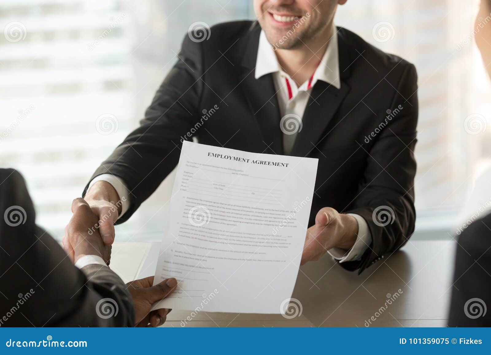 recruiter giving employment agreement to applicant