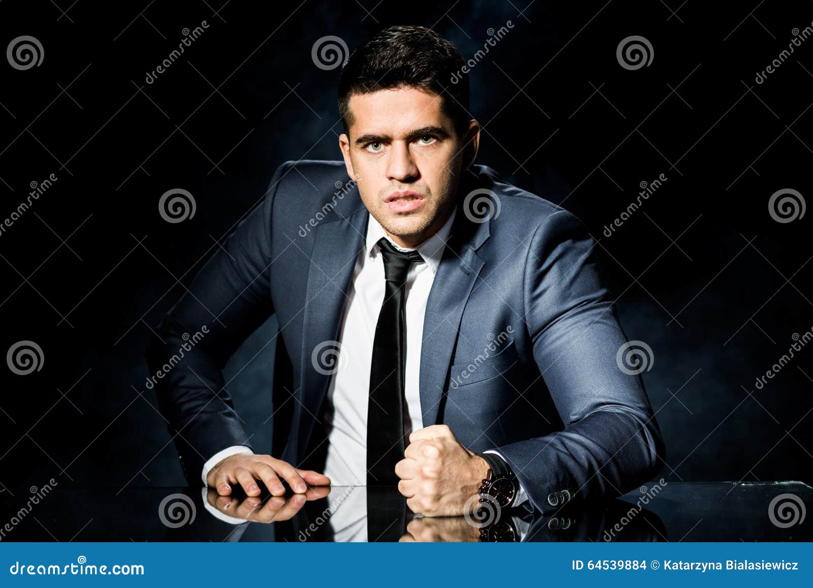 Young man slam your fist on the table