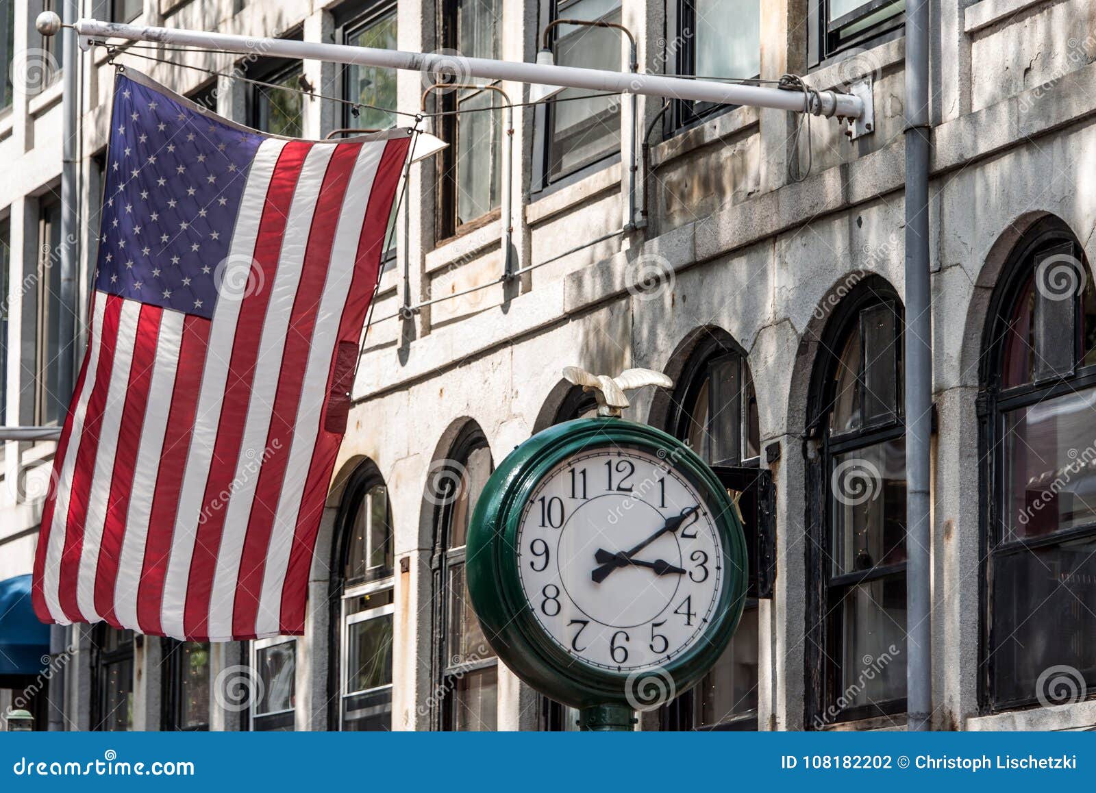 Boston, MA USA - Shopping Mall Store Front with American Flag Waving with a  Big Clock beside it Stock Photo - Image of patriotism, entrance: 108182202