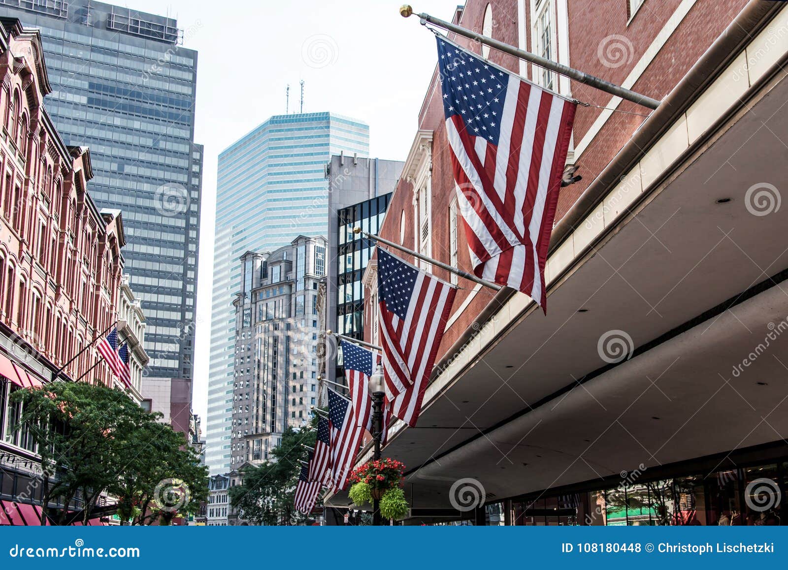 Boston, MA USA Shopping Mall Store Front with American Flags Waving with  Skyscrapers in the Background Skyline Stock Photo - Image of business,  people: 108180448