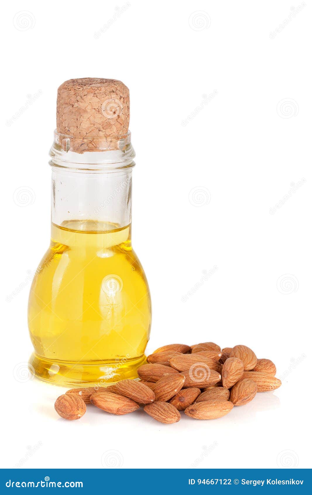 Bottle of Almond Oil and Almonds Isolated on White Background Stock