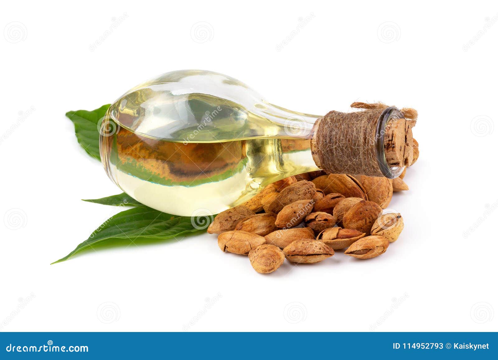 Bottle of Almond Oil and Almonds on White Background Stock Image