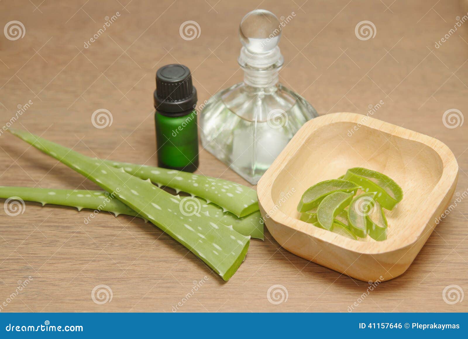 bottle of aloe vera essential oil with fresh plant