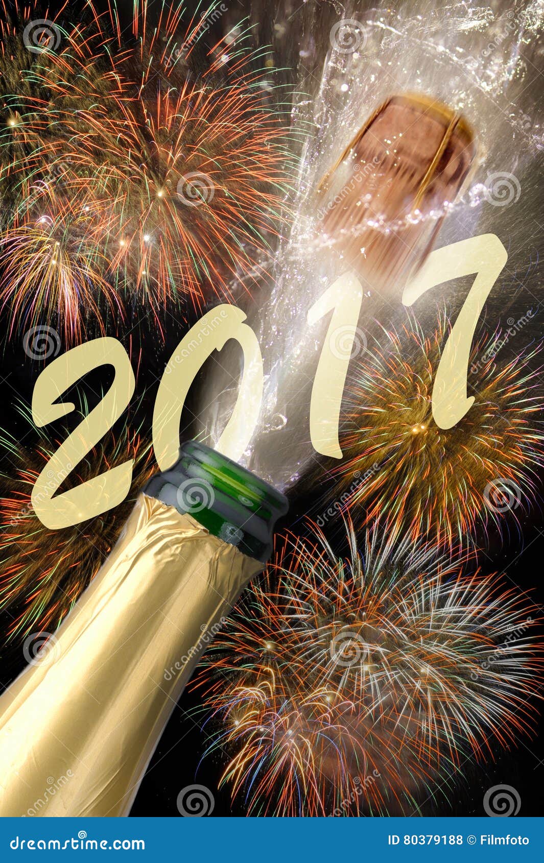 Bottle of Champagne with Popping Cork at New Years 2017 Stock Photo