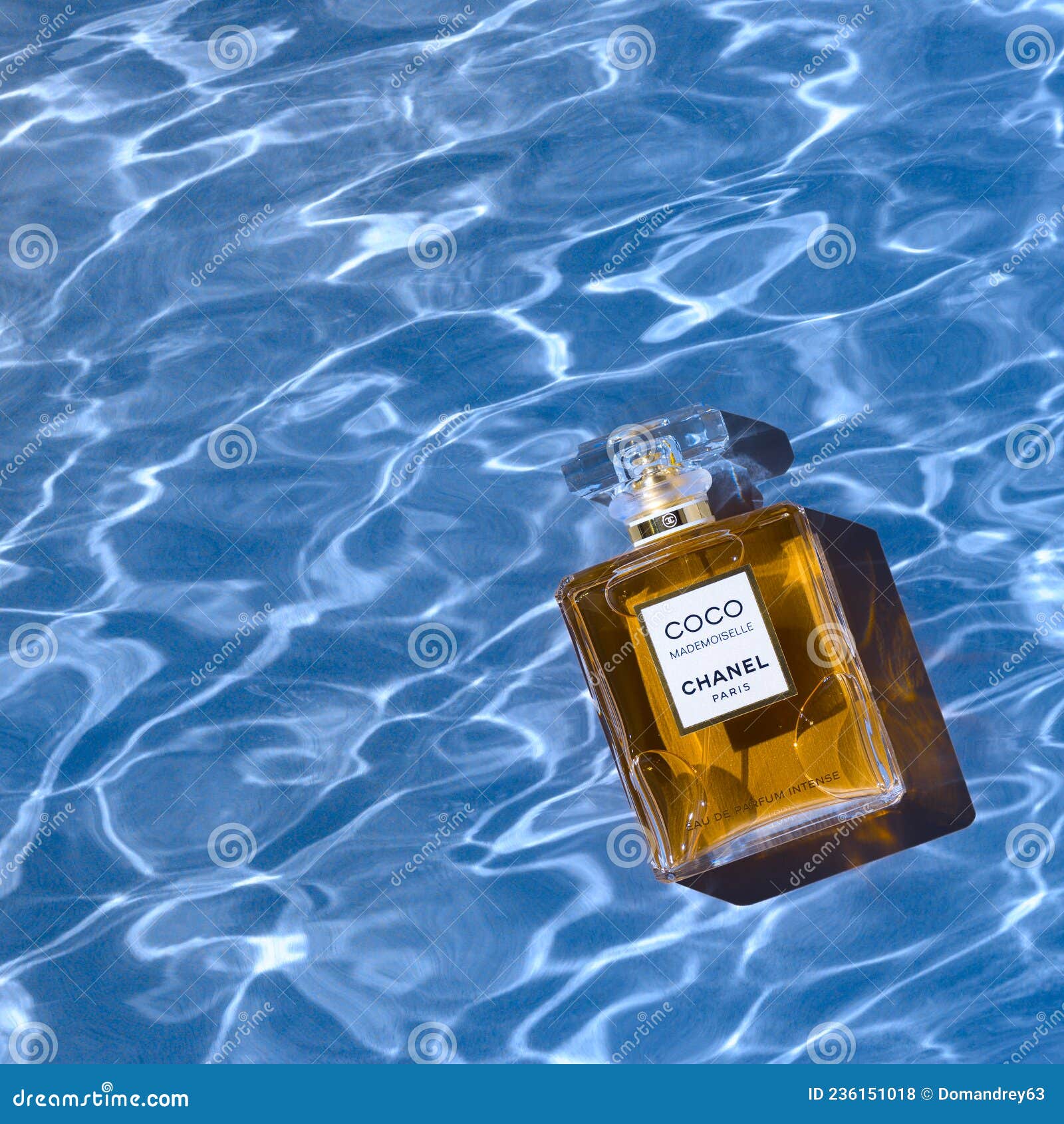 A Bottle of Chanel Perfume on the Background of the Texture of Water, with  a Beautiful Shadow with Highlights. Coco Editorial Stock Photo - Image of  luxury, cologne: 236151018